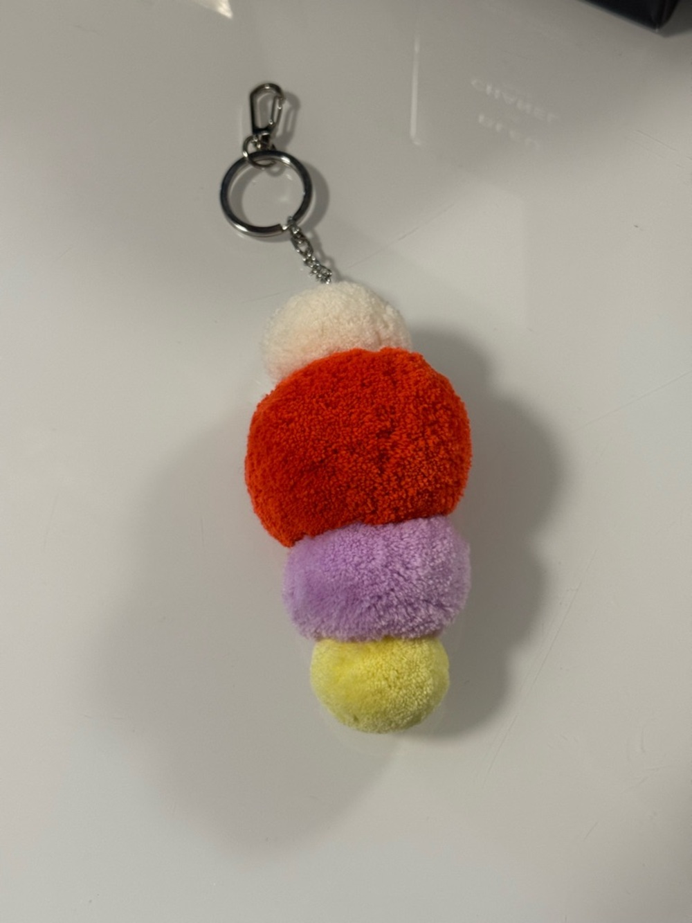 Plush Pom Pom Keychain in Red, Purple, Yellow, Cream